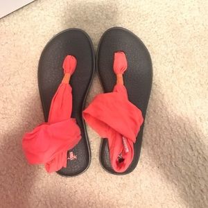 Woman’s salmon colored sandal